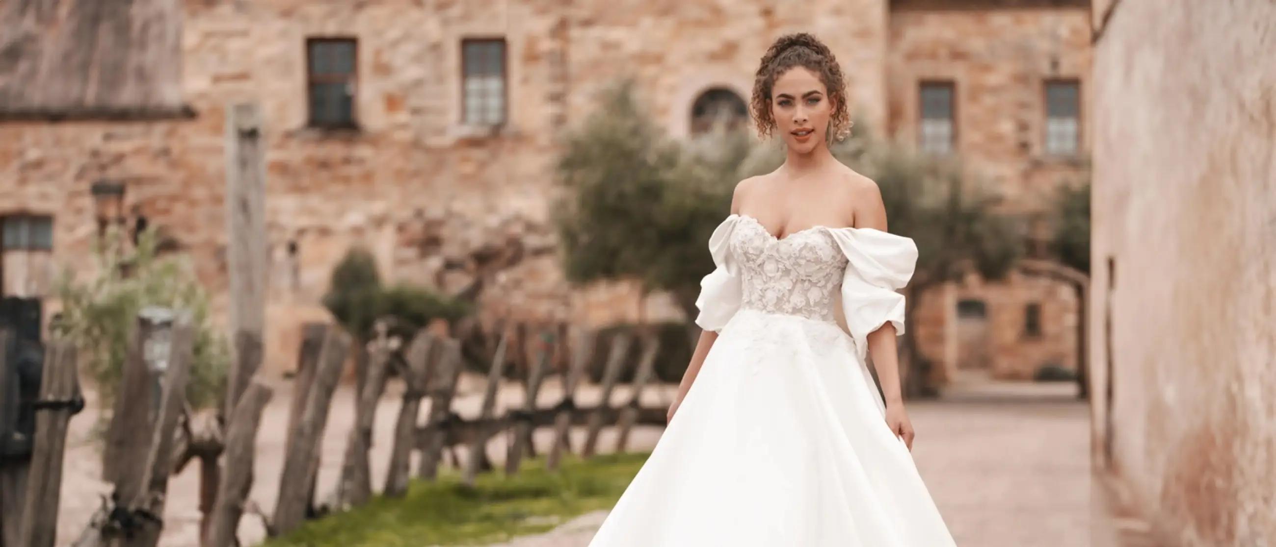 Model wearing a white gown